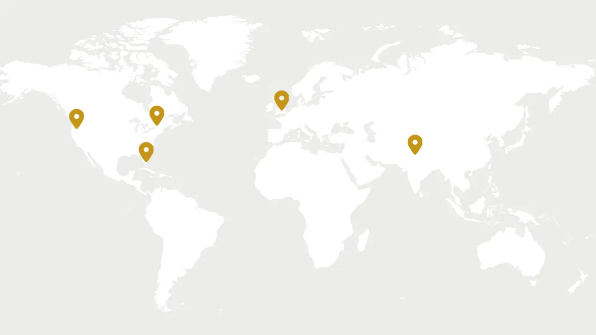 World map with pins in the US, Canada, UK, and India