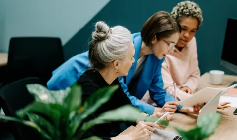 Photo of 3 people collaborating at work