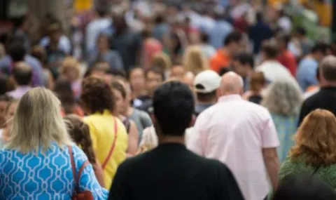 image of a crowd of people on a street.