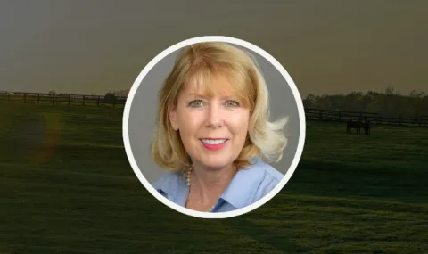 Photo of Rebecca Barnett against a background of a green pasture.