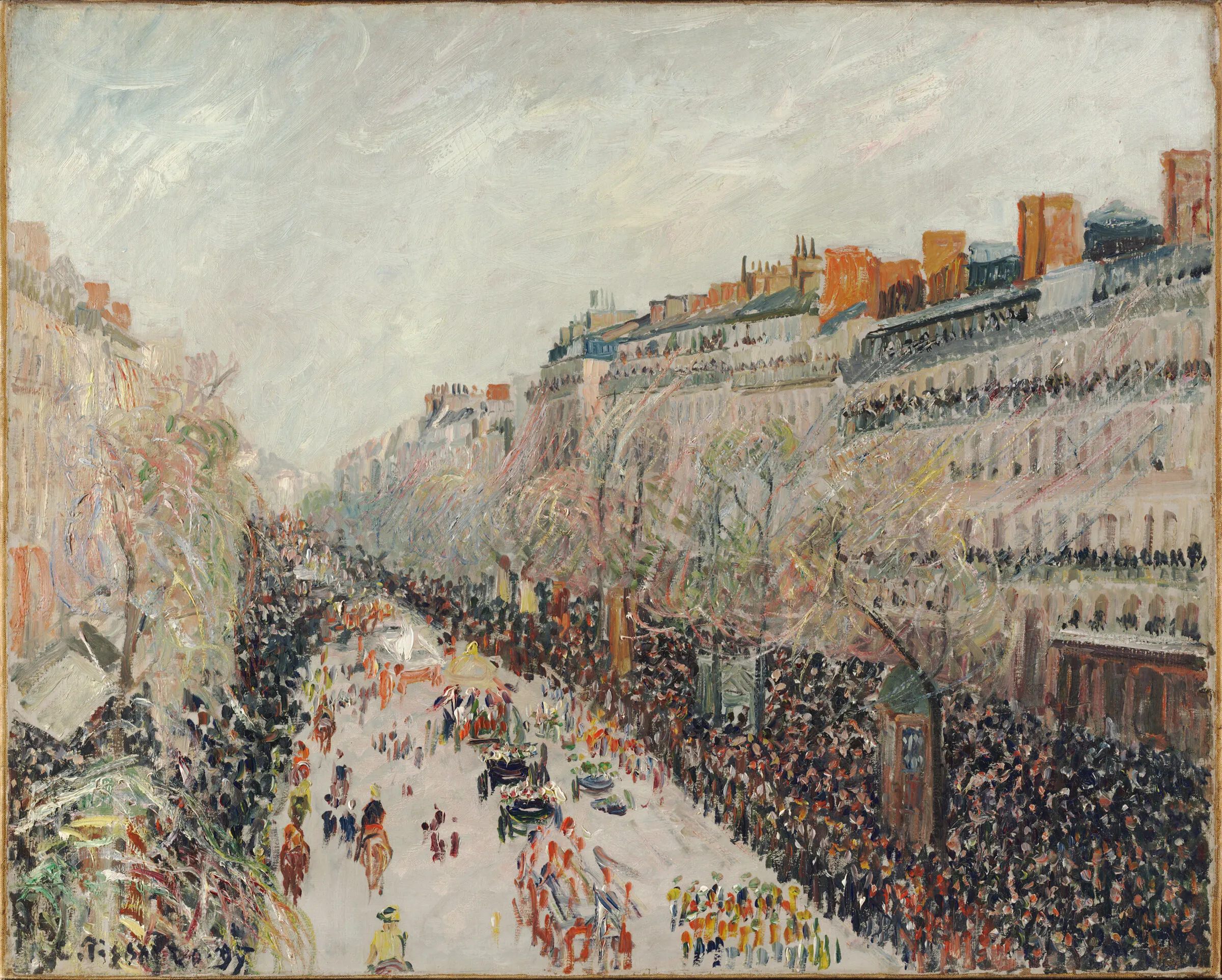 A parade in Paris with large crowds along the sidewalks flank a street filled with horse drawn carriages and marchers. 